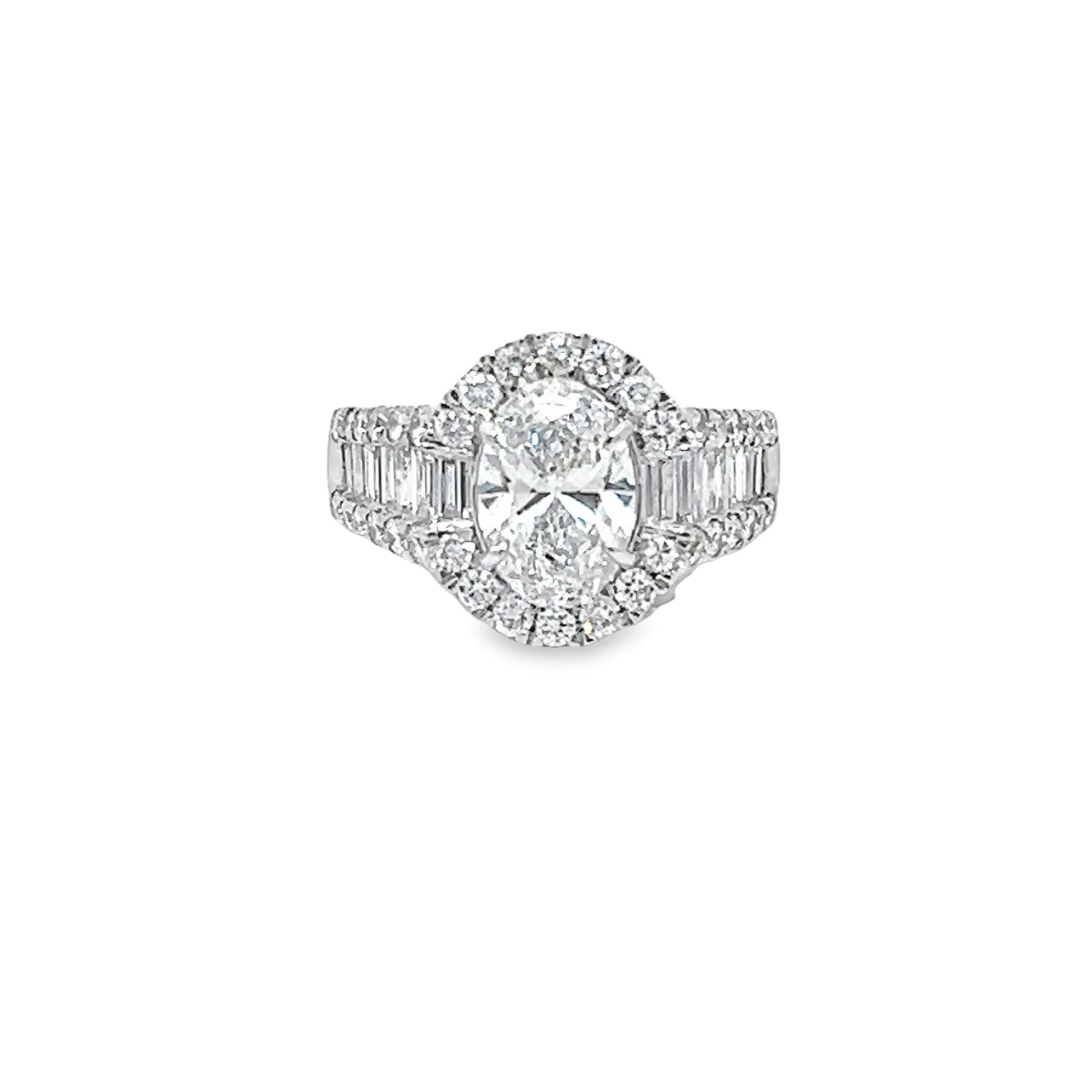 Lab Grown Oval Center Diamond set in a Natural Mined Diamond Halo and Tapered Baguette Engagement Ring