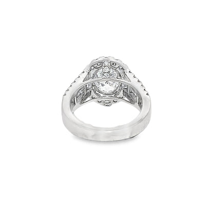 Lab Grown Oval Center Diamond set in a Natural Mined Diamond Halo and Tapered Baguette Engagement Ring